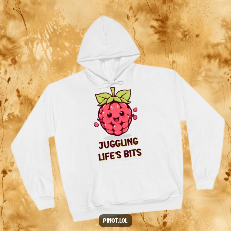 Funny kawaii raspberry character hoodie, juggling seeds with expert skill, offering warm and humorous comfort.