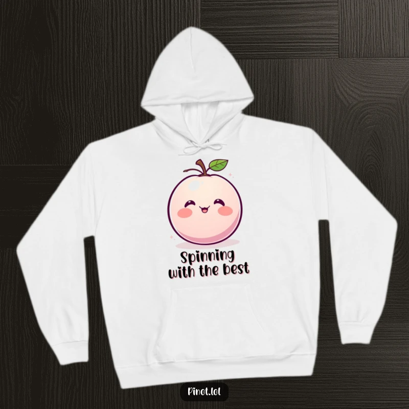 Funny hoodie featuring a blushing, round plum character with small eyes, caught mid-giggle and spin.